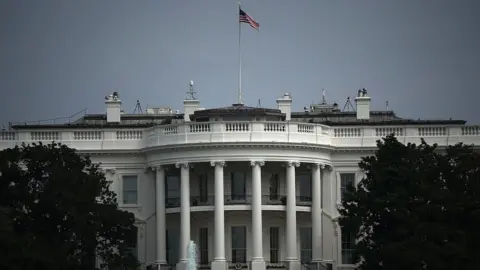 Getty Images The White House flag flies at full-staff two days after John McCain's death.