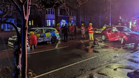 Crash between two cars including a police car