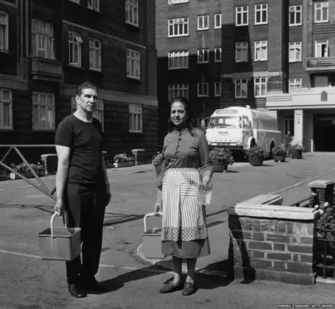Evening Standard/Getty Images Residents from Grove Hall Court collecting water from a tanker