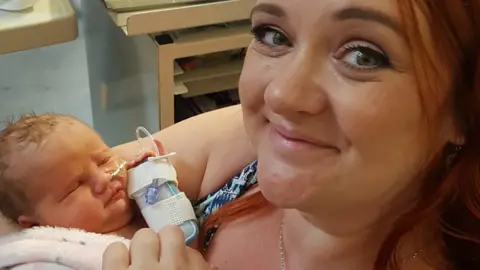 Hayley Bean Hayley holding Willow as a newborn