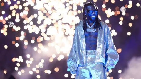 Giuseppe Maffia/Getty Images Burna Boy performs prior to the Champions League Final at Ataturk Olympic Stadium in Istanbul Turkey - Saturday 10 June 2023