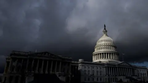 Bill Clark/Getty Images Dark clouds over US Capitol