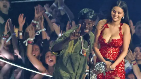 Reuters Nigerian singer Rema and US singer and actress Selena Gomez accept the Best Afrobeats award for Calm Down onstage during the MTV Video Music Awards at the Prudential Center in Newark, New Jersey, US - 12 September 2023