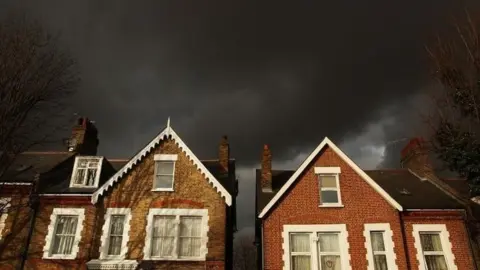 Getty Images Houses and clouds