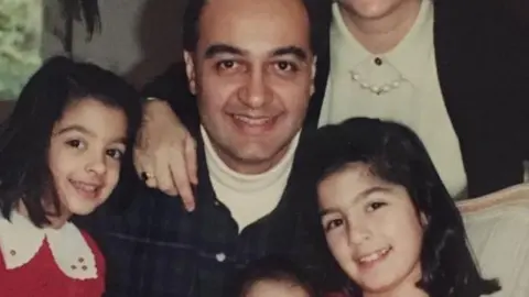 BBC/family photo Morad Tahbaz, with his two young daughters