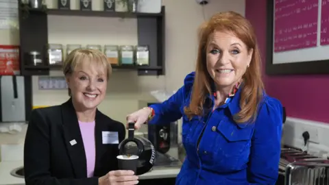 PA Media Sarah, Duchess of York, pictured with Coronation Street actor Sally Dynevor, during their visit to the Prevent Breast Cancer charity's headquarters at Wythenshawe Hospital's Nightingale Centre in Manchester.