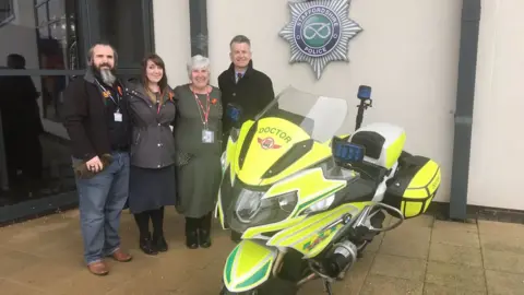 Staffordshire Police Mr Van de Sande's family with Dr Ian Mew