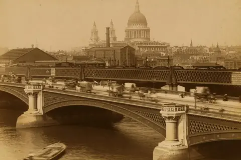 Getty Images View of carriage and pedestrian traffic on the Blackfriars Bridge with St. Paul's Cathedral in the background, London, 1888.