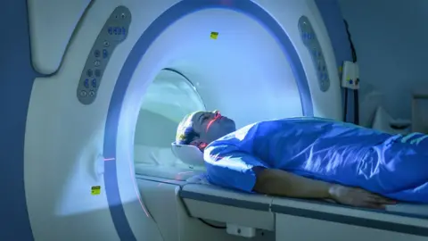 Getty Images A stock image of a man going through an MRI scanner