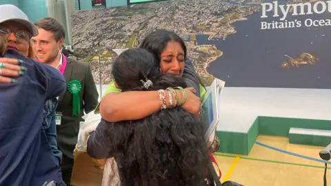 Saahi Aroori hugs a friend or relative after winning a seat on Plymouth City Council.