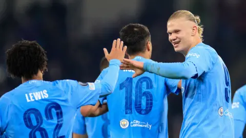 Man City players celebrate