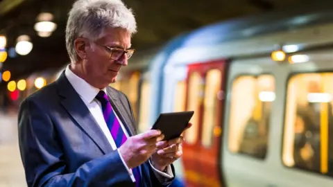 Getty Images Man using mobile device on the Tube