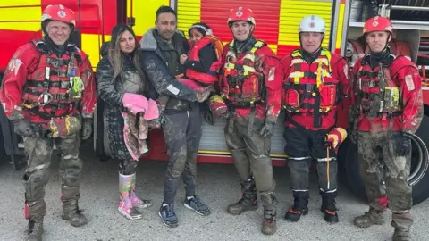 Essex County Fire and Rescue Service Essex firefighters rescued a family stuck in a boat on mudflats