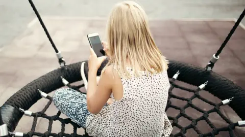 Getty Images A stock image of a child using a smartphone