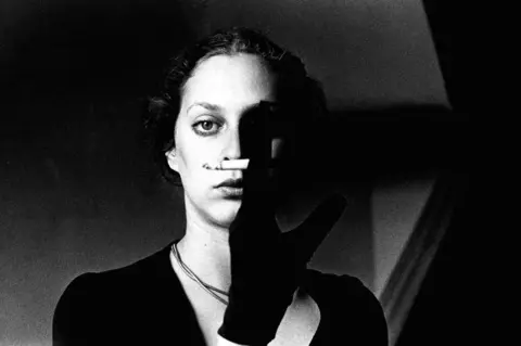 Ralph Gibson Woman holding a cigarette