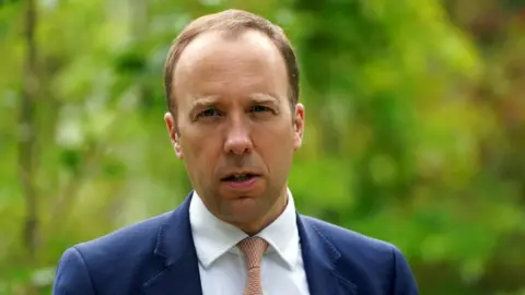 Reuters FILE PHOTO: British Secretary of State for Health, Matt Hancock speaks at a memorial tree planting ceremony at Oxford Botanic Gardens, following a G7 health ministers meeting, ahead of the G7 leaders' summit, at Mansfield College, Oxford University in Oxford, Britain June 4, 2021