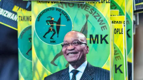 MK party regalia showing a photo of Jacob Zuma and the party's spear logo