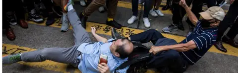 Getty Images A HK argument on the streets during a protest on November 19