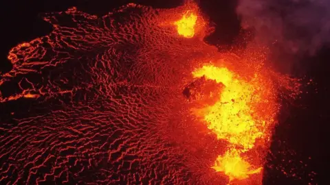 Lava flows from Fagradalsfjall volcano in Iceland, about 40km (25 miles) from the capital Reykjavik on 6 August 2022
