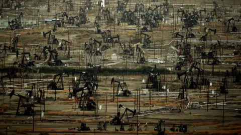 AFP/Getty A general view shows oil pumping jacks and drilling pads at the Kern River Oil Field in Bakersfield, California on July 28, 2015.