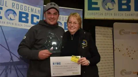 EOBC Chris Fisher receives prize