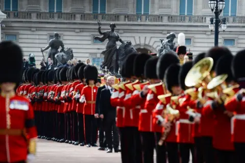 Reuters The Coldstream Guards are seen near Buckingham Palace during the procession for the Lying-in State of Queen Elizabeth II