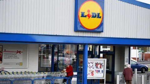 Getty Images Shoppers outside a Lidl store