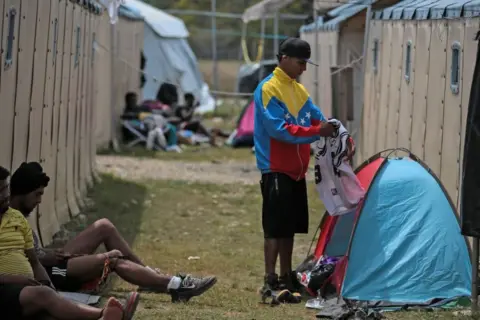 Getty Images Migrants at the San Vicente Migrant Reception Station (ESM) in Meteti, Darien province, Panama, near the border with Colombia, on February 11, 2021.
