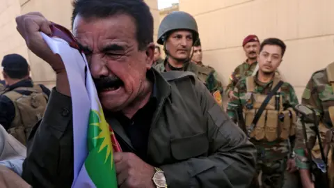 Getty Images Iraqi Kurds demonstrate at the US consulate in Irbil, the capital of autonomous Iraqi Kurdistan, 20 October 2017