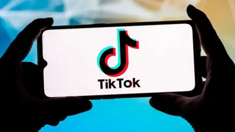Getty Images The TikTok logo is displayed on a smartphone.