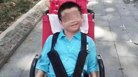 Weibo An image shared on Chinese social media of Yan Cheng sitting in a wheelchair