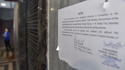 Getty Images Notice outside PNB branch announcing closure