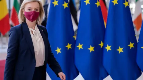 Getty Images British Secretary of State for Foreign, Commonwealth and Development Affairs Elizabeth Mary Truss talks to media prior an extraordinary foreign affairs council in the Europa, the EU Council headquarter on March 4, 2022 in Brussels, Belgium