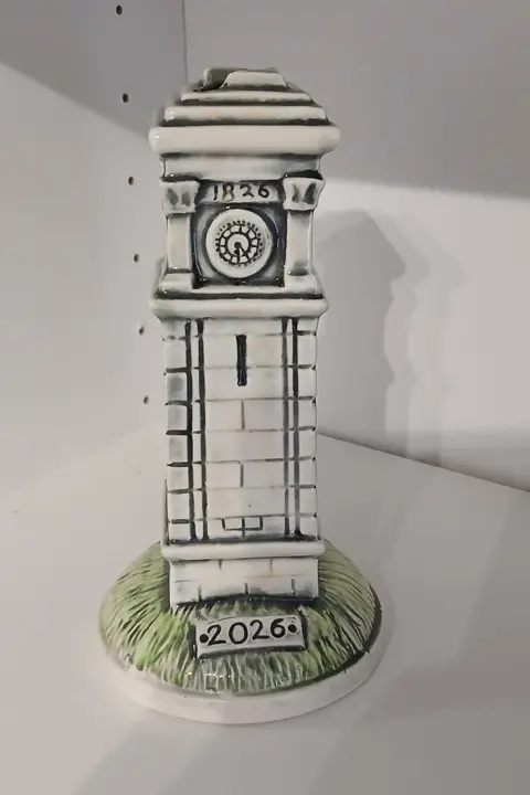 Goole Civic Society A photo of a small replica of the clock tower with a slot for money to go in.