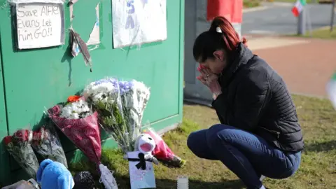 Christopher Furlong A woman grieves outside Alder Hey Hospital