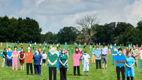 Geraint Lewis/Standing with Giants  NHS workers with the installation at South Park, Oxford