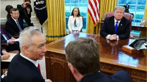 AFP Donald Trump and China's Vice Premier Liu He in the Oval Office