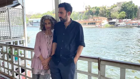 Wael Hussein/BBC Egyptian novelist Ahdaf Soueif and her son, the writer Omar Robert Hamilton, on their houseboat