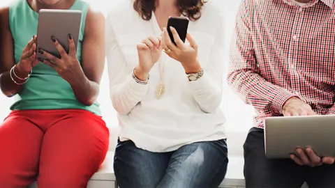 Getty Images People using mobile devices