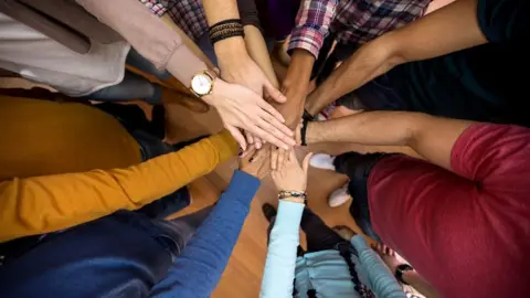 Getty Images Concept image: All hands together, racial equality in team