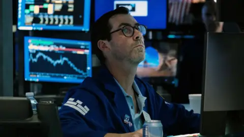 Getty Images A trader on the stock exchange