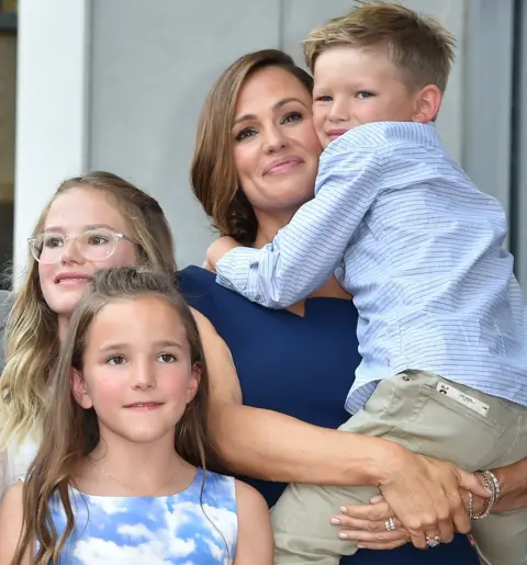 Getty Images Actress Jennifer Garner poses with her children Violet Affleck, Seraphina Rose Elizabeth Affleck and Samuel Garner Affleck at her star on the Hollywood Walk of Fame, on 20 August 2018.