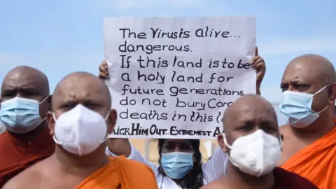 Getty Images A demonstration in Sri Lanka in support of the government's policy of mandating cremations for those who die of Covid-19