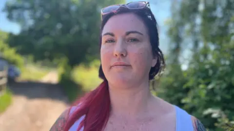 a woman with pink hair