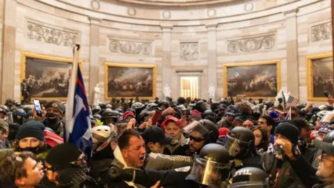 Getty Images Police confront rioters who entered Capitol Hill buildings