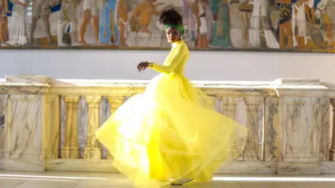 @OUTOFBARBARASBOX Barbara Adeniken is a bright yellow tulle dress