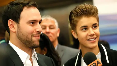Getty Images Scooter Braun and Justin Bieber