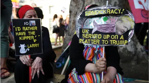 Getty Images People take part in a protest against Boris Johnson organised by the People's Assembly near Downing Street