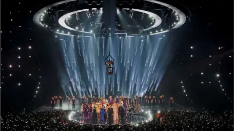 Reuters Duncan Laurence and other past Eurovision performers on stage performing