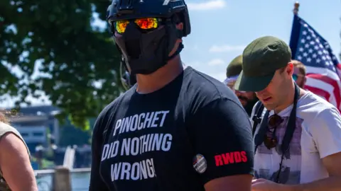 Getty Images 'Tiny' Toese at a Portland rally in 2018. On his shirt is 'RWDS' which stands for 'Right wing death squad'